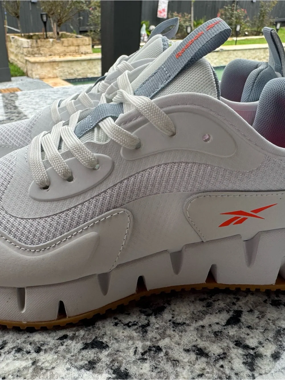 Reebok White and Gray Trail Runner with Orange Logo Accent